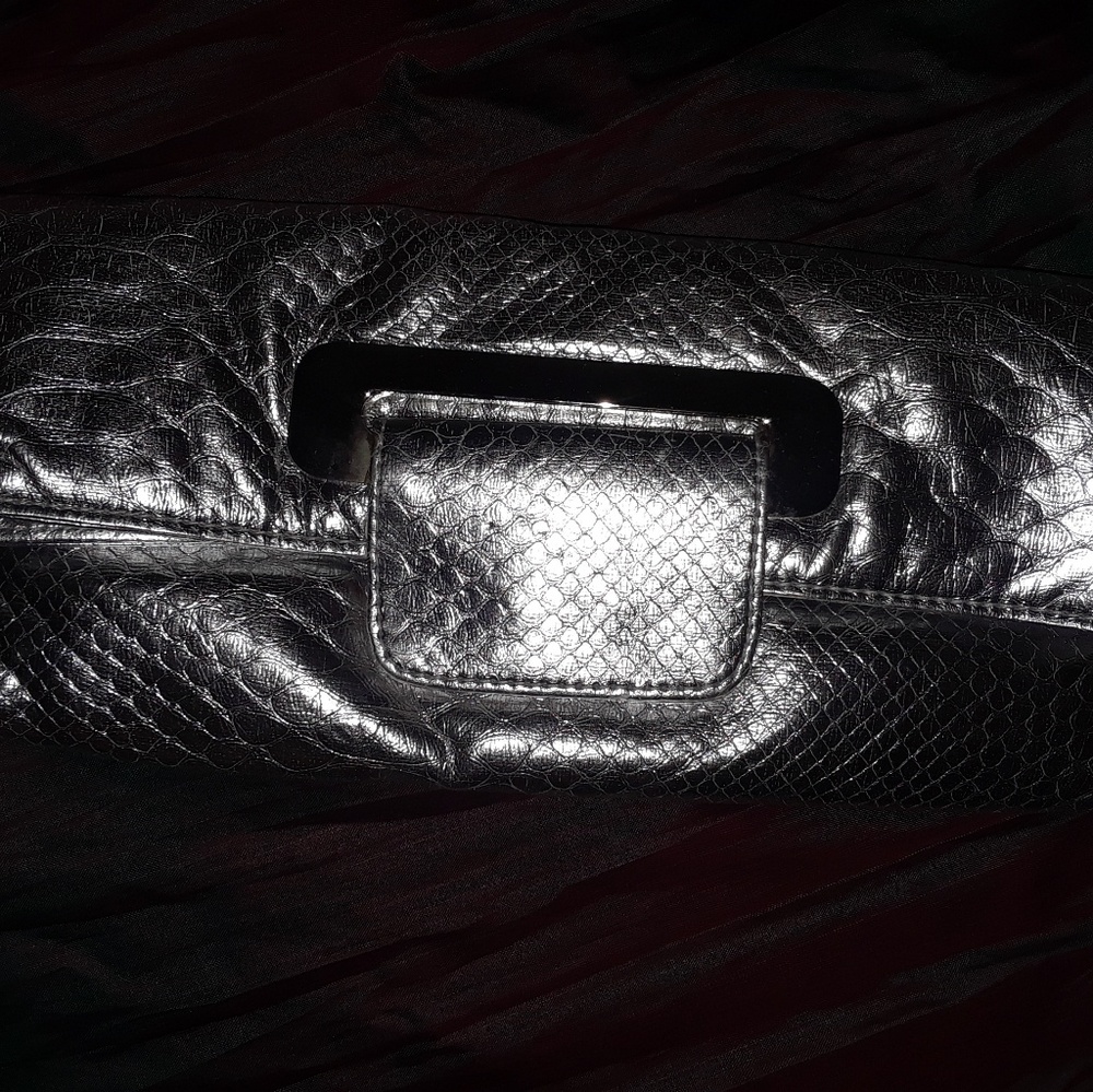 Beautiful preowned metallic silver clutch